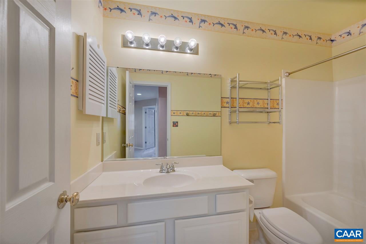 4753 Clover Ridge Court Charlottesville, VA 22901 - Photo 19 of 24 a bathroom with a sink vanity mirror and toilet