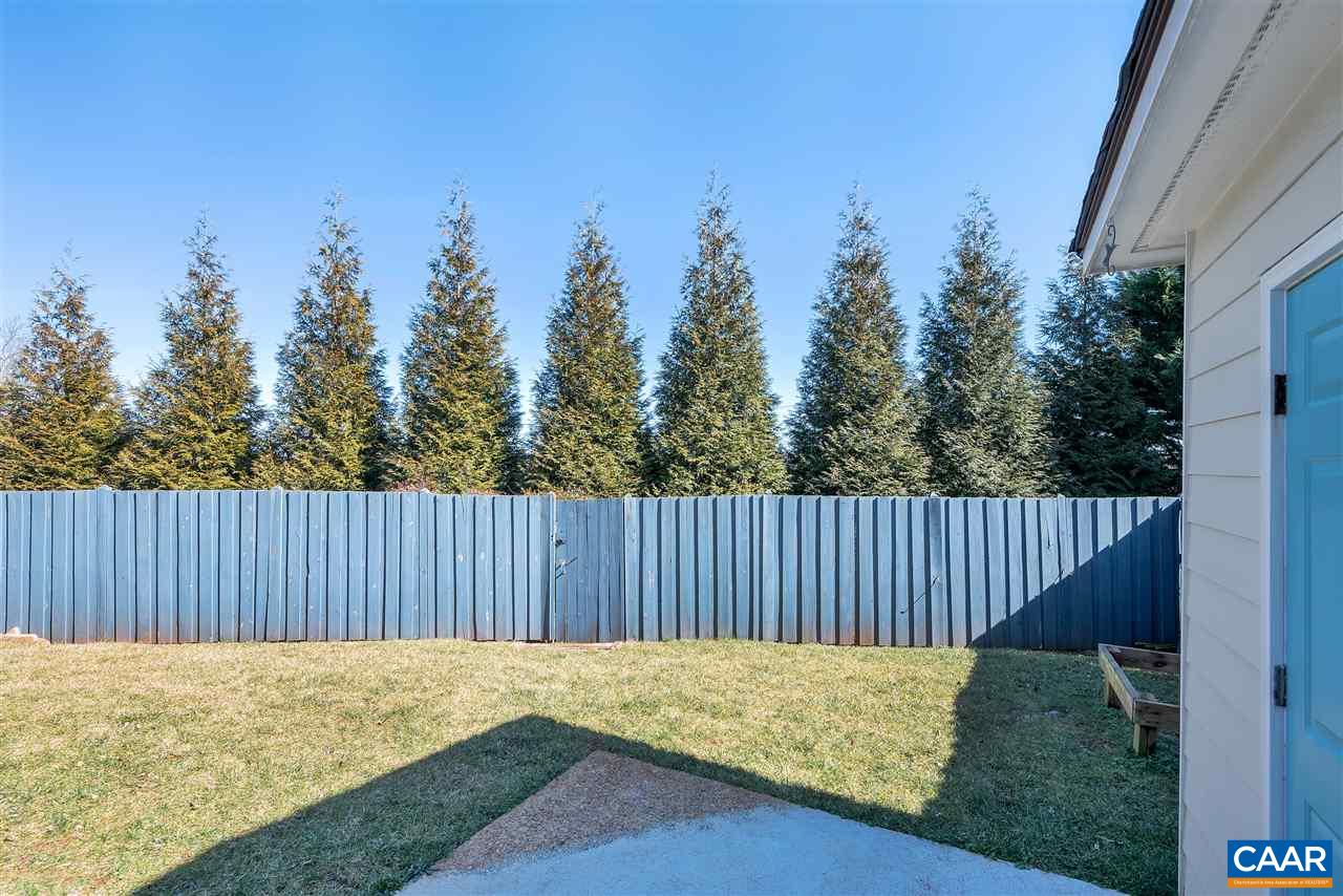 4753 Clover Ridge Court Charlottesville, VA 22901 - Photo 22 of 24 a backyard of a house with wooden fence