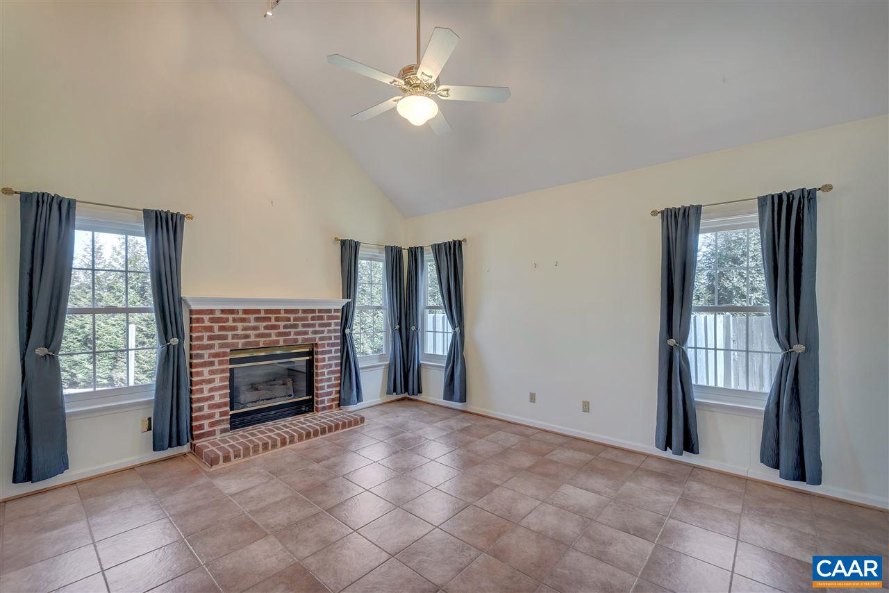 4753 Clover Ridge Court Charlottesville, VA 22901 - Photo 6 of 24 an empty room with windows and fireplace