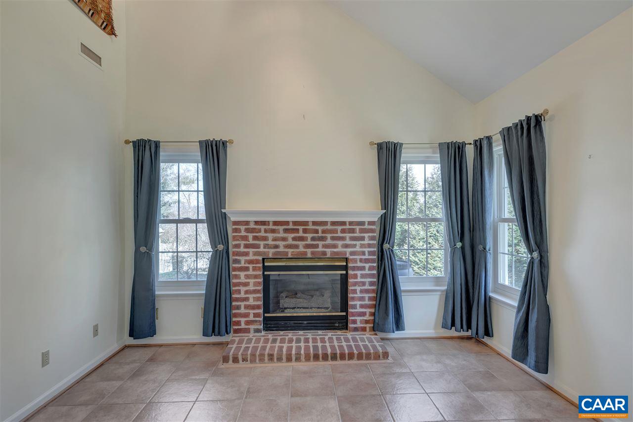 4753 Clover Ridge Court Charlottesville, VA 22901 - Photo 7 of 24 a living room with a fireplace and a window