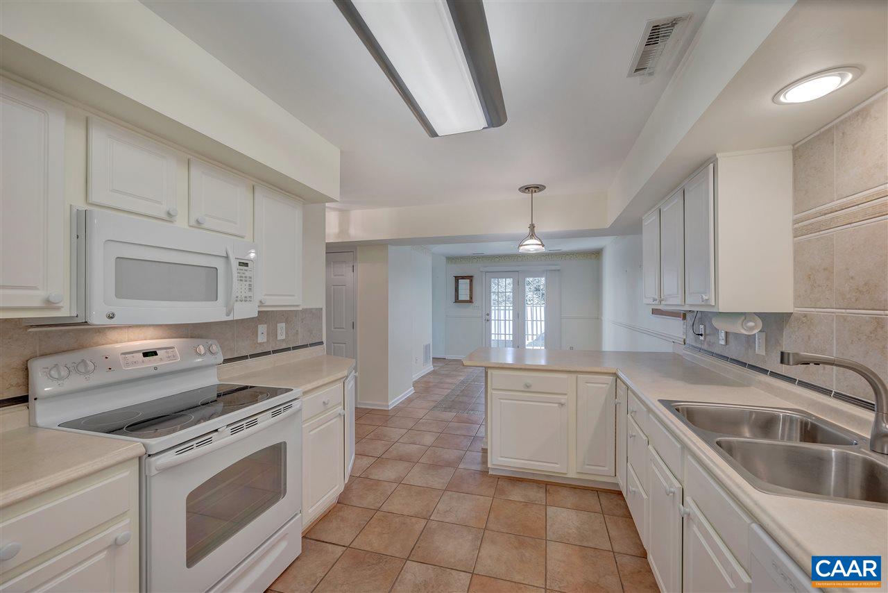 4753 Clover Ridge Court Charlottesville, VA 22901 - Photo 10 of 24 a kitchen with a sink stove and cabinets
