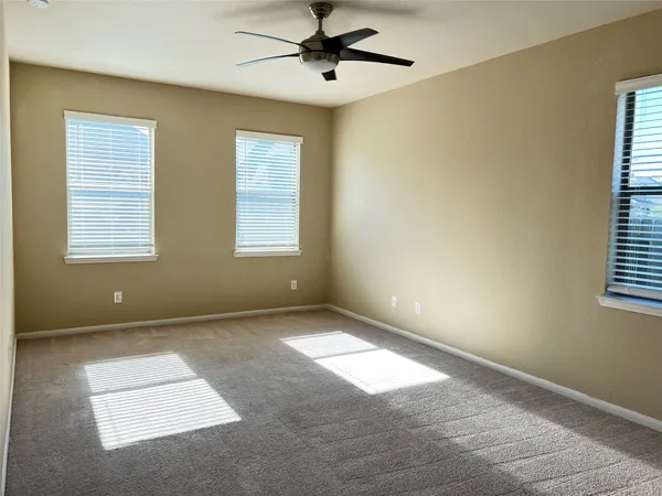 a view of an empty room with windows