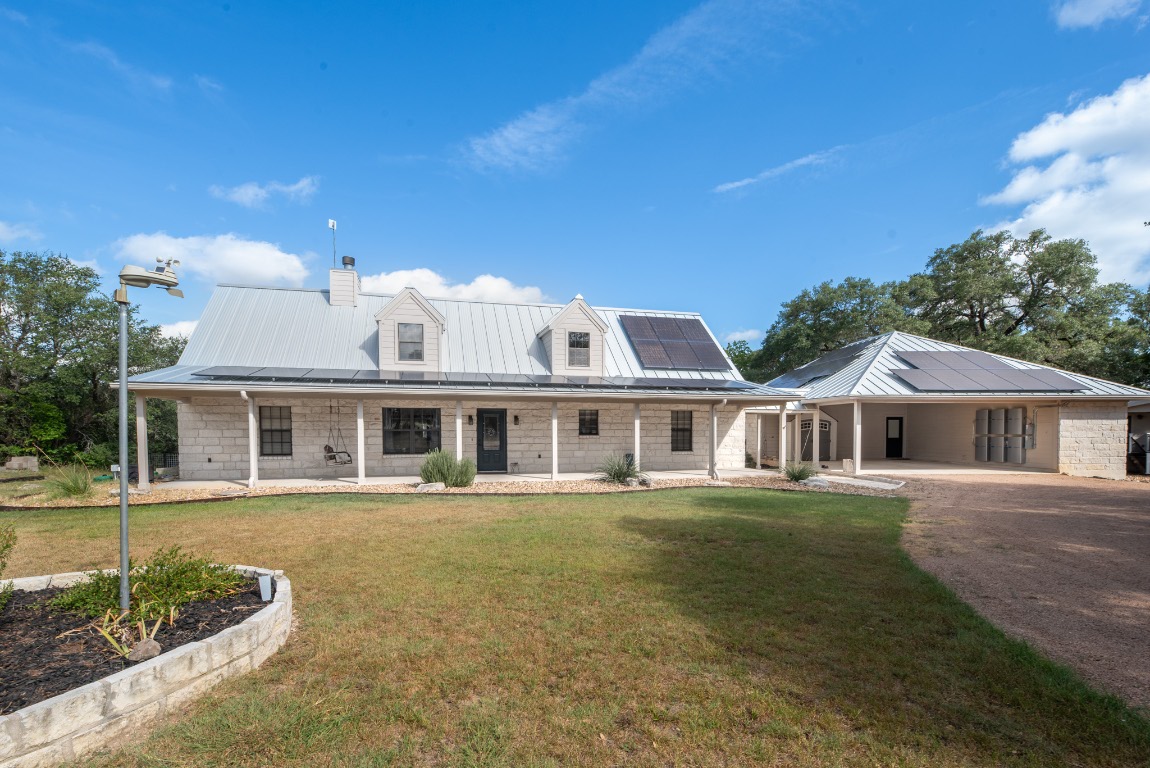 front view of a house with a garden
