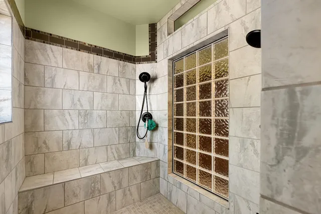 a view of a dining room with furniture and a kitchen