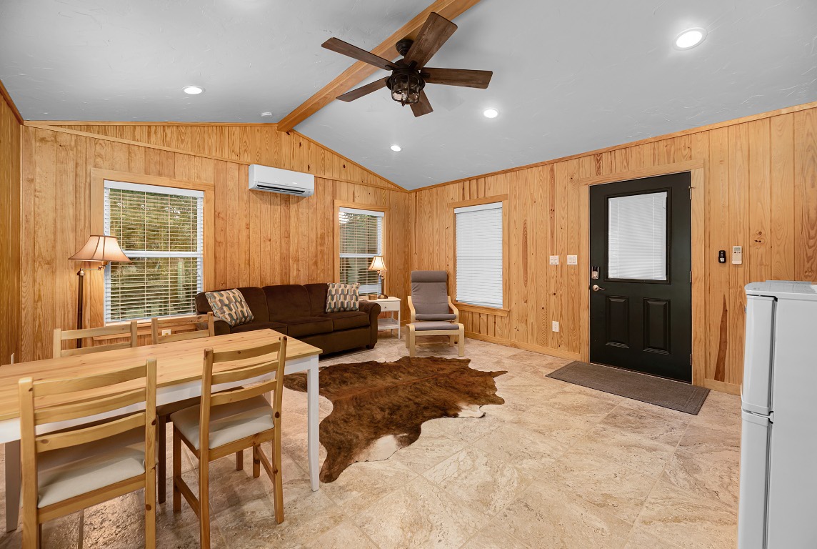 1546 Cox Road Blanco, TX 78606 - Photo 29 of 40 a living room with furniture a large window and stainless steel appliances