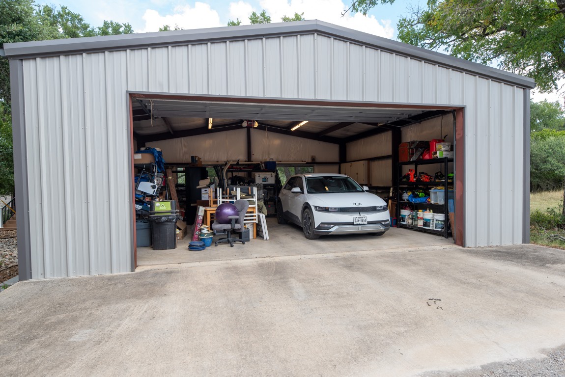 1546 Cox Road Blanco, TX 78606 - Photo 37 of 40 a view of a car park in front of garage