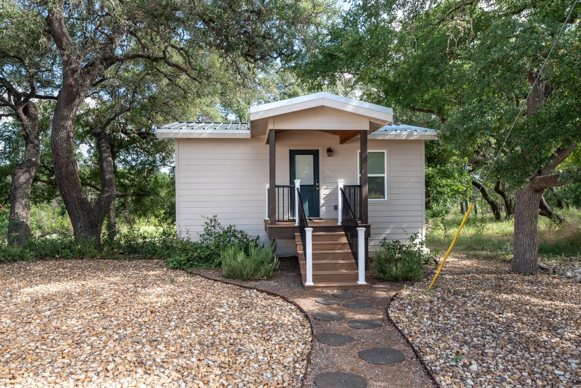 1546 Cox Road Blanco, TX 78606 - Photo 4 of 40 Bungalow-style home with a metal roof and covered porch