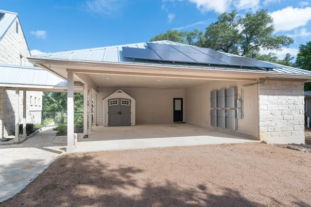 a living room with furniture a flat screen tv and a window