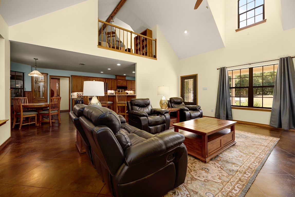 1546 Cox Road Blanco, TX 78606 - Photo 7 of 40 Living room with beamed ceiling, high vaulted ceiling, a ceiling fan, and recessed lighting