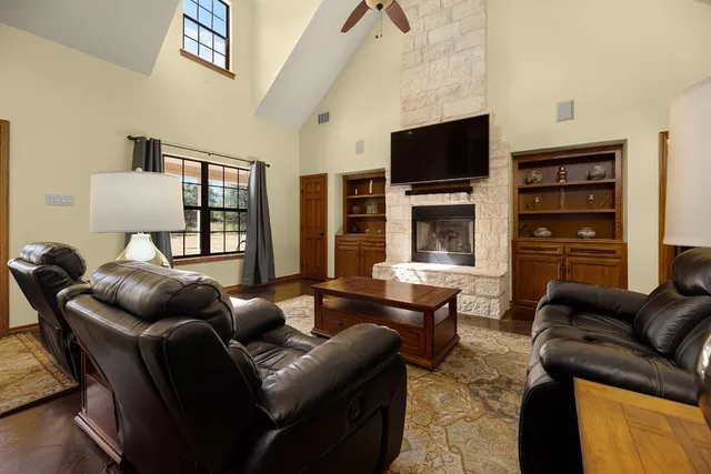 a kitchen with stainless steel appliances granite countertop a sink refrigerator and microwave