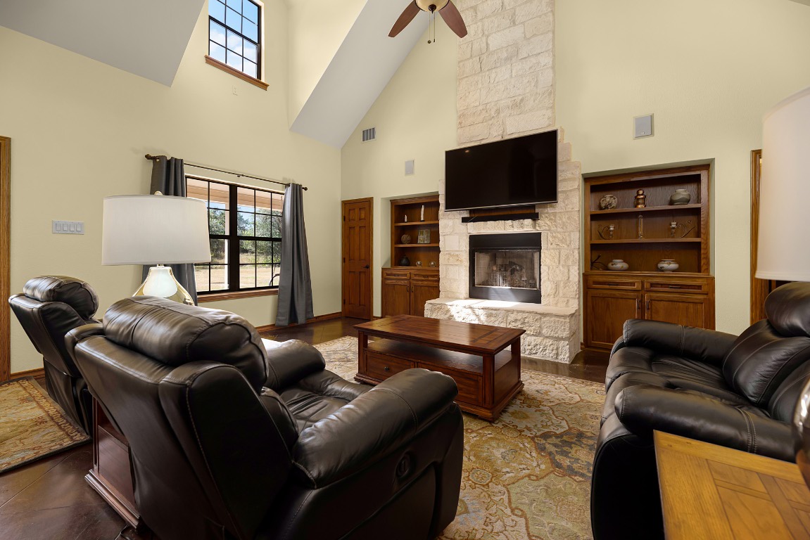 1546 Cox Road Blanco, TX 78606 - Photo 8 of 40 a living room with furniture a flat screen tv and a window
