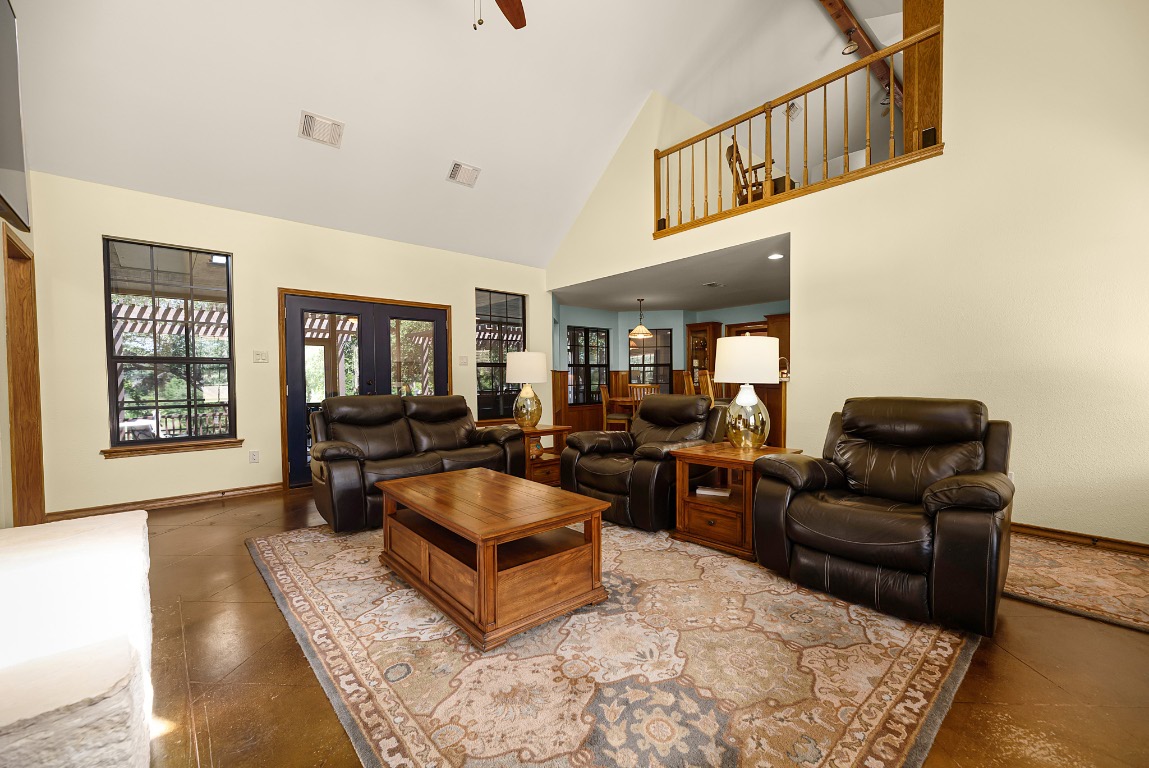 1546 Cox Road Blanco, TX 78606 - Photo 9 of 40 Living area with high vaulted ceiling and ceiling fan