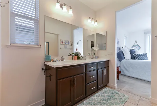 a white toilet sitting next to a bathroom sink