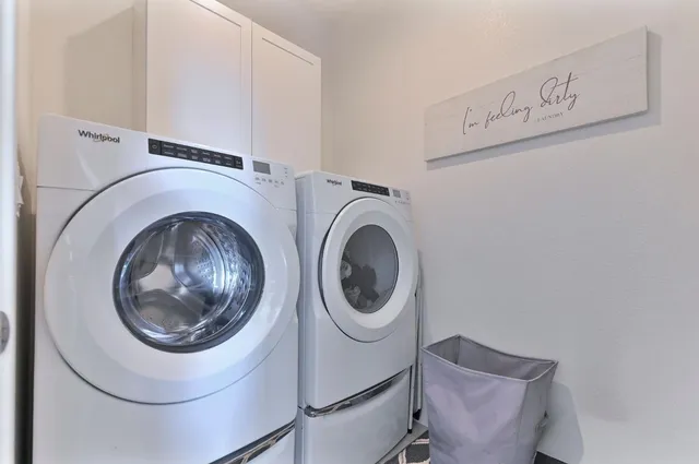 a view of balcony with furniture and a potted plant