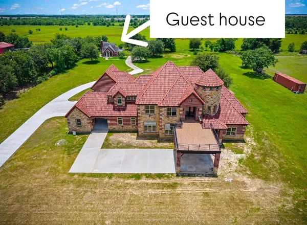 a view of house with garden space ocean view