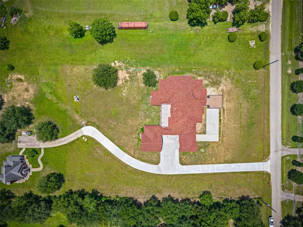 an aerial view of a house with a garden