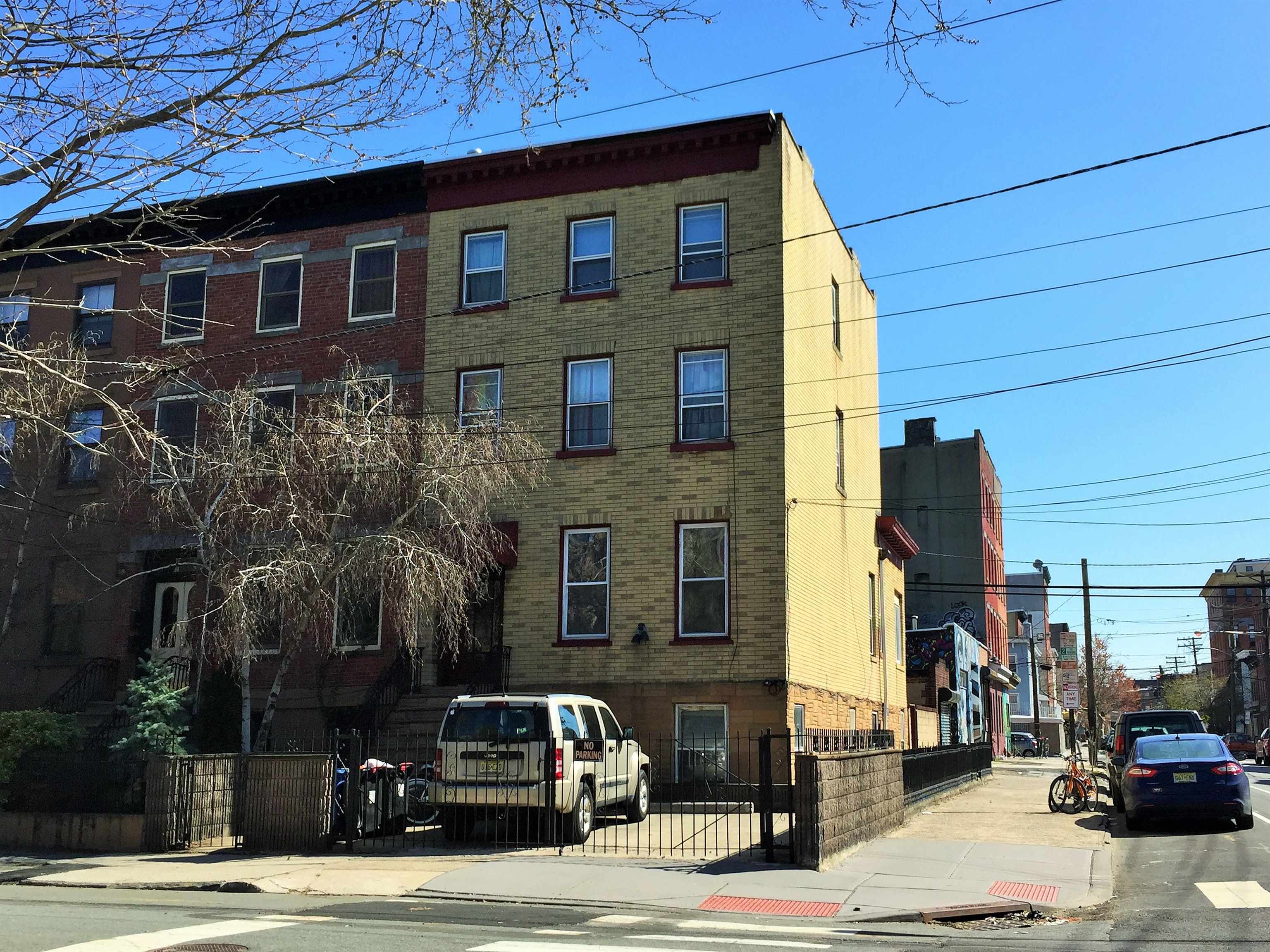 297 4th Street, Unit 2 Jersey City, NJ 07302 - Photo 1 of 19 a car parked in front of a house