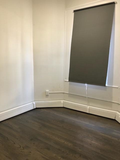 297 4th Street, Unit 2 Jersey City, NJ 07302 - Photo 12 of 19 a view of wooden floor in a room