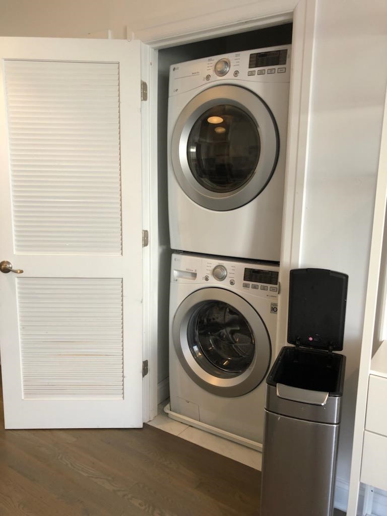 297 4th Street, Unit 2 Jersey City, NJ 07302 - Photo 14 of 19 a utility room with dryer and washer