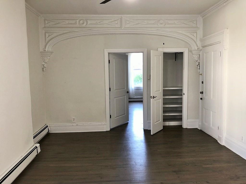 297 4th Street, Unit 2 Jersey City, NJ 07302 - Photo 6 of 19 wooden floor in an empty room