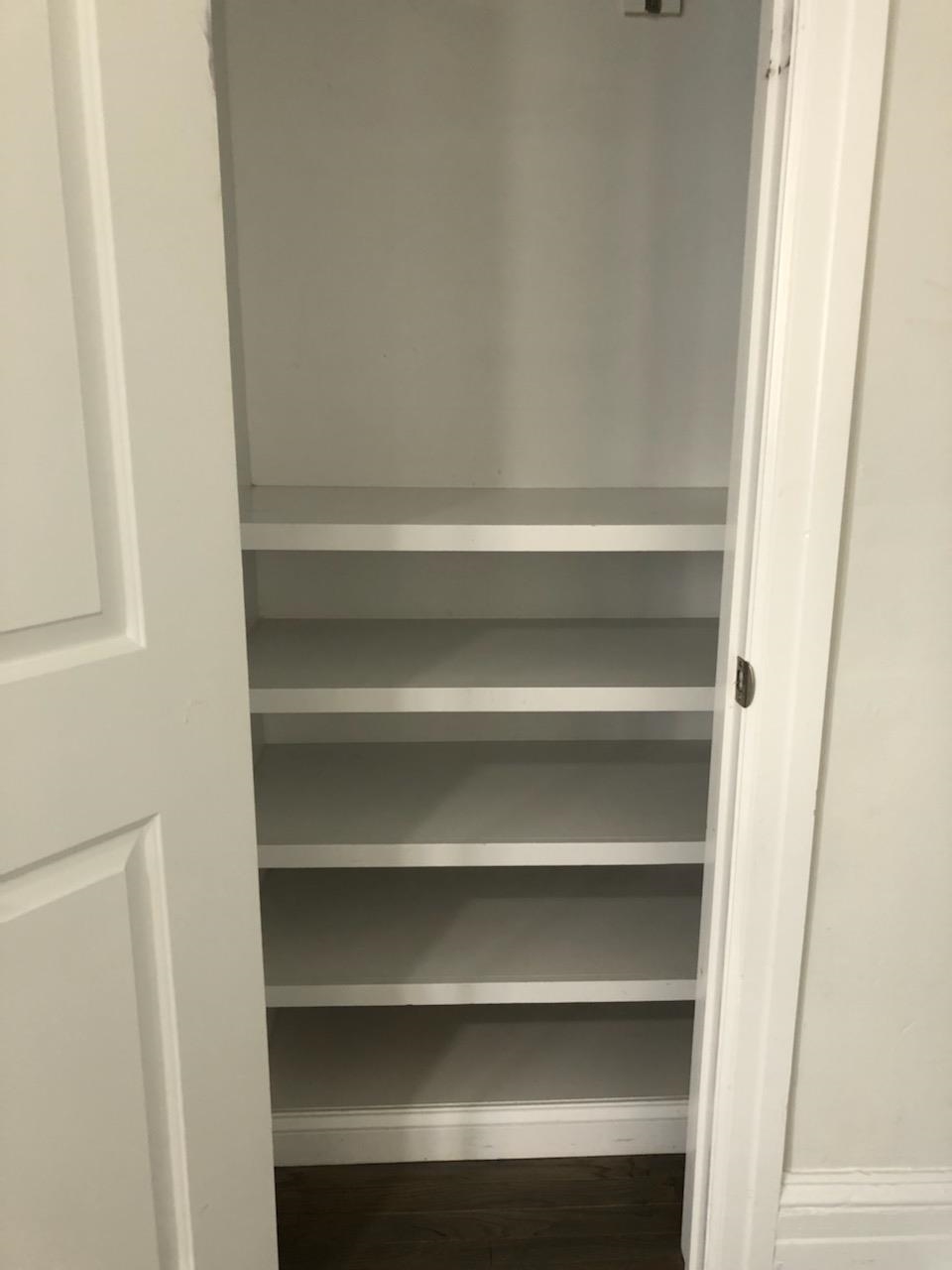 297 4th Street, Unit 2 Jersey City, NJ 07302 - Photo 8 of 19 a view of walk in closet with empty racks