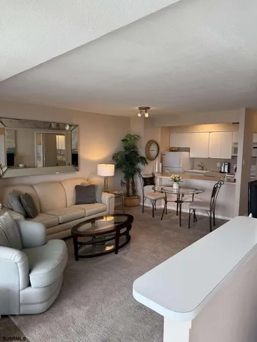 a bedroom with a bed and a dresser in it