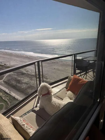 a view of swimming pool with outdoor seating and city view