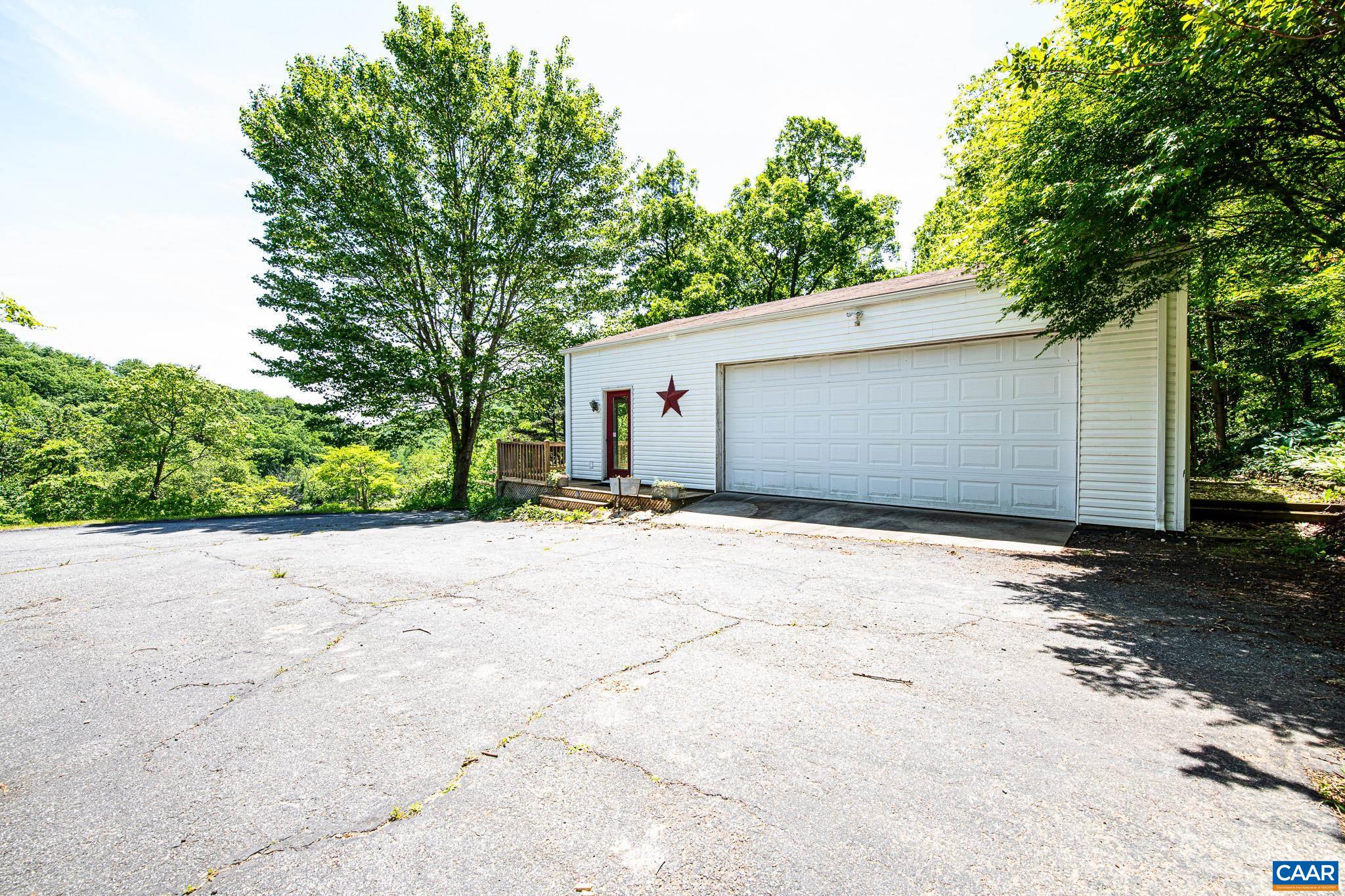 3033 Bacon Hollow Road Dyke, VA 22935 - Photo 29 of 66 a backyard of a house