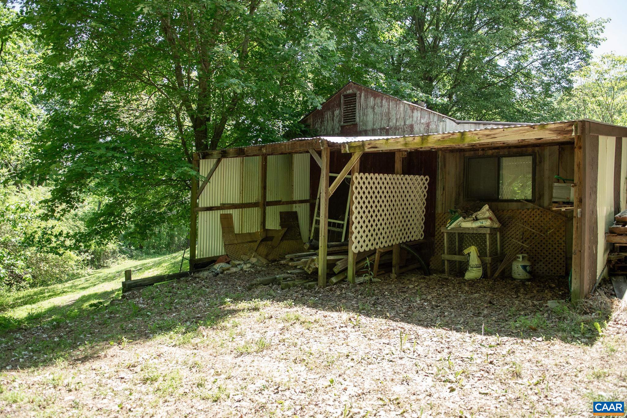 3033 Bacon Hollow Road Dyke, VA 22935 - Photo 38 of 66 a view of a chair and table in the backyard
