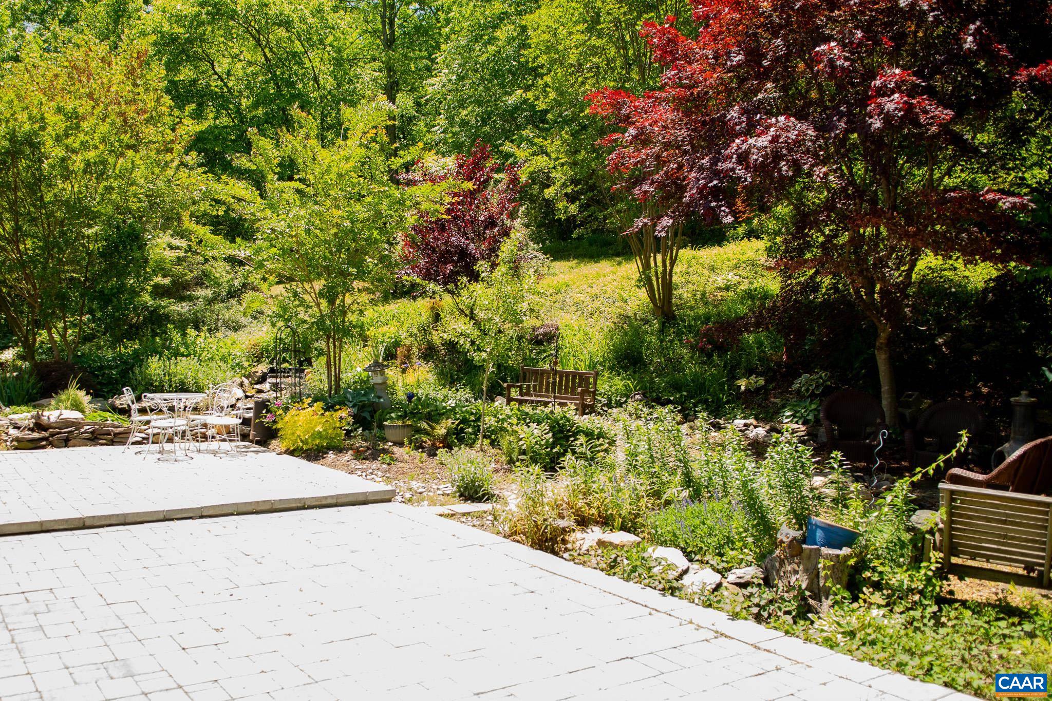 3033 Bacon Hollow Road Dyke, VA 22935 - Photo 44 of 66 a view of a garden with a pathway