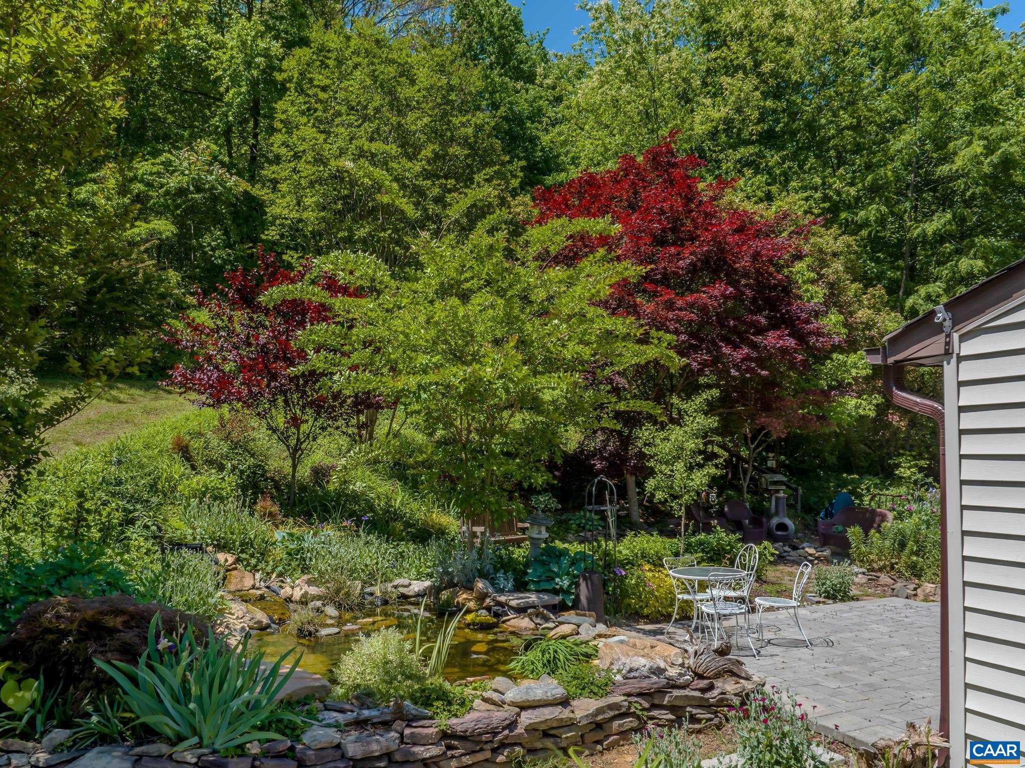 3033 Bacon Hollow Road Dyke, VA 22935 - Photo 5 of 66 a backyard of a house with lots of green space