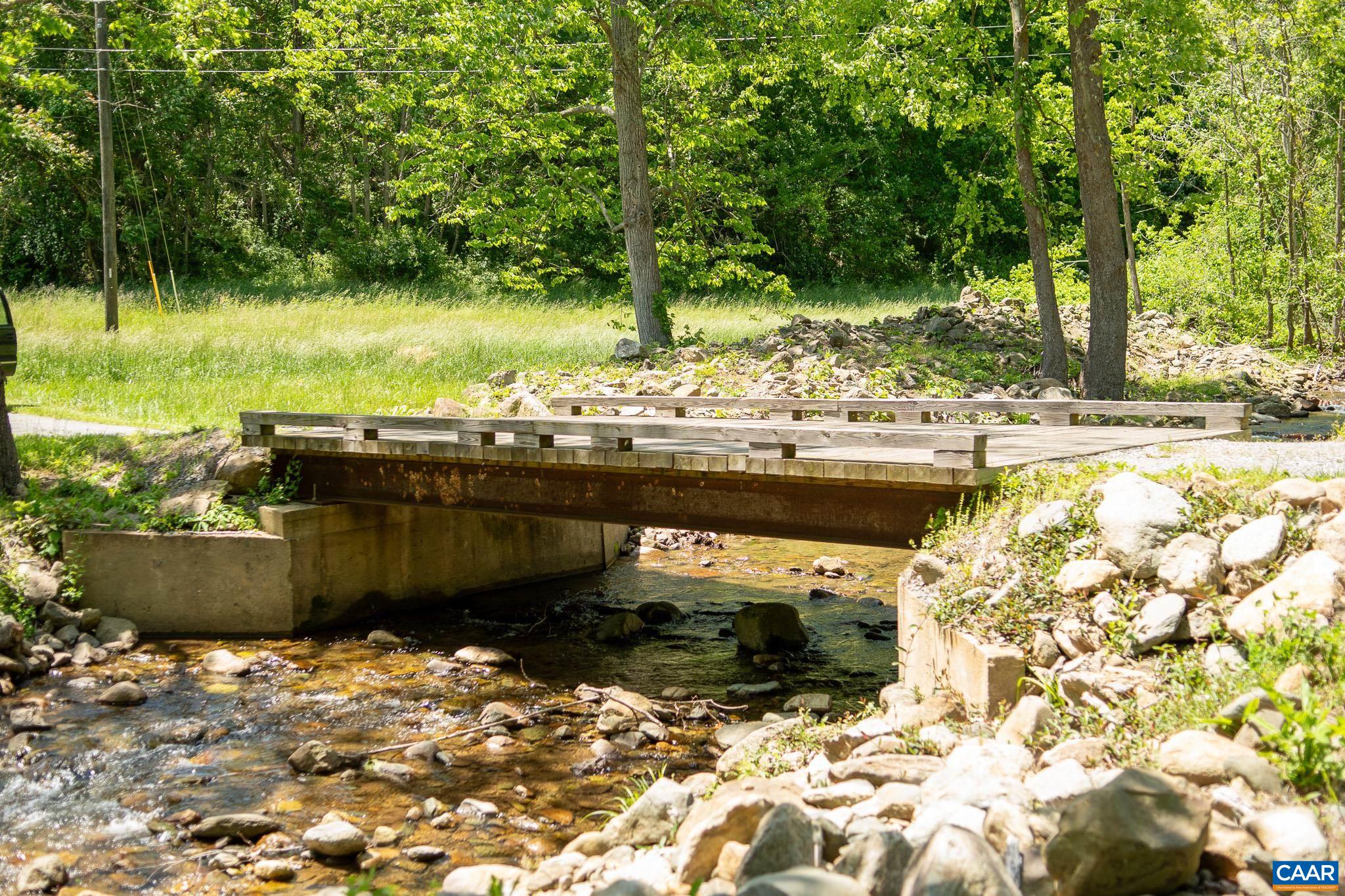 3033 Bacon Hollow Road Dyke, VA 22935 - Photo 58 of 66 a view of a backyard of a house with a lake view
