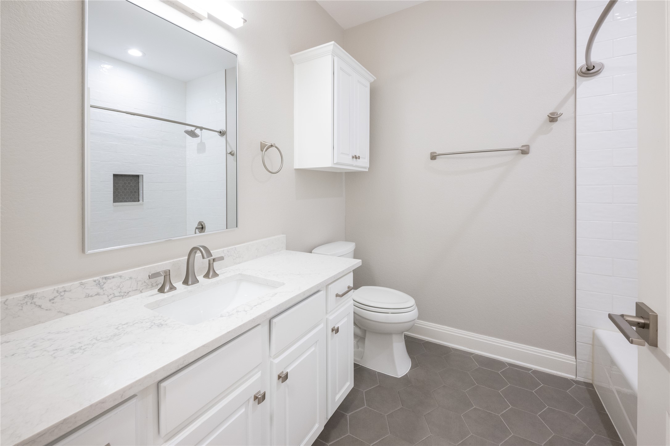 232 Sunrise Ridge Loop Austin, TX 78738 - Photo 27 of 37 Vanity with white shaker-style cabinetry, a white countertop, and an undermount sink