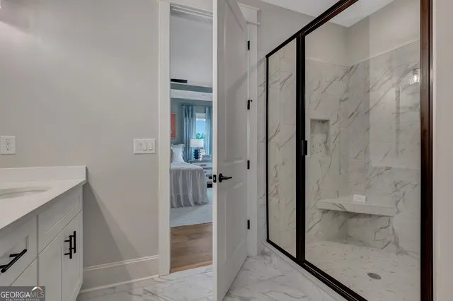 a view of walk in closet with empty racks