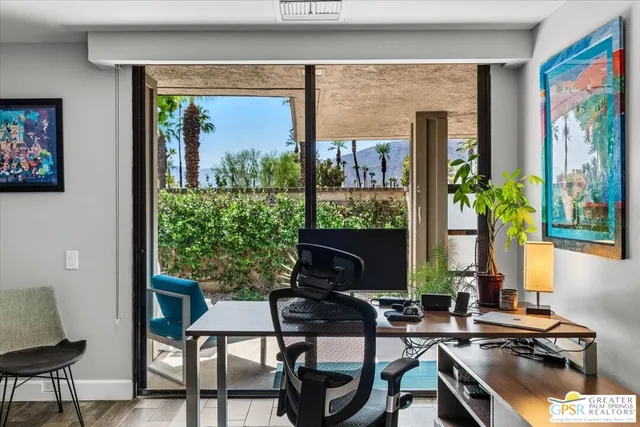 a workspace with furniture and a window