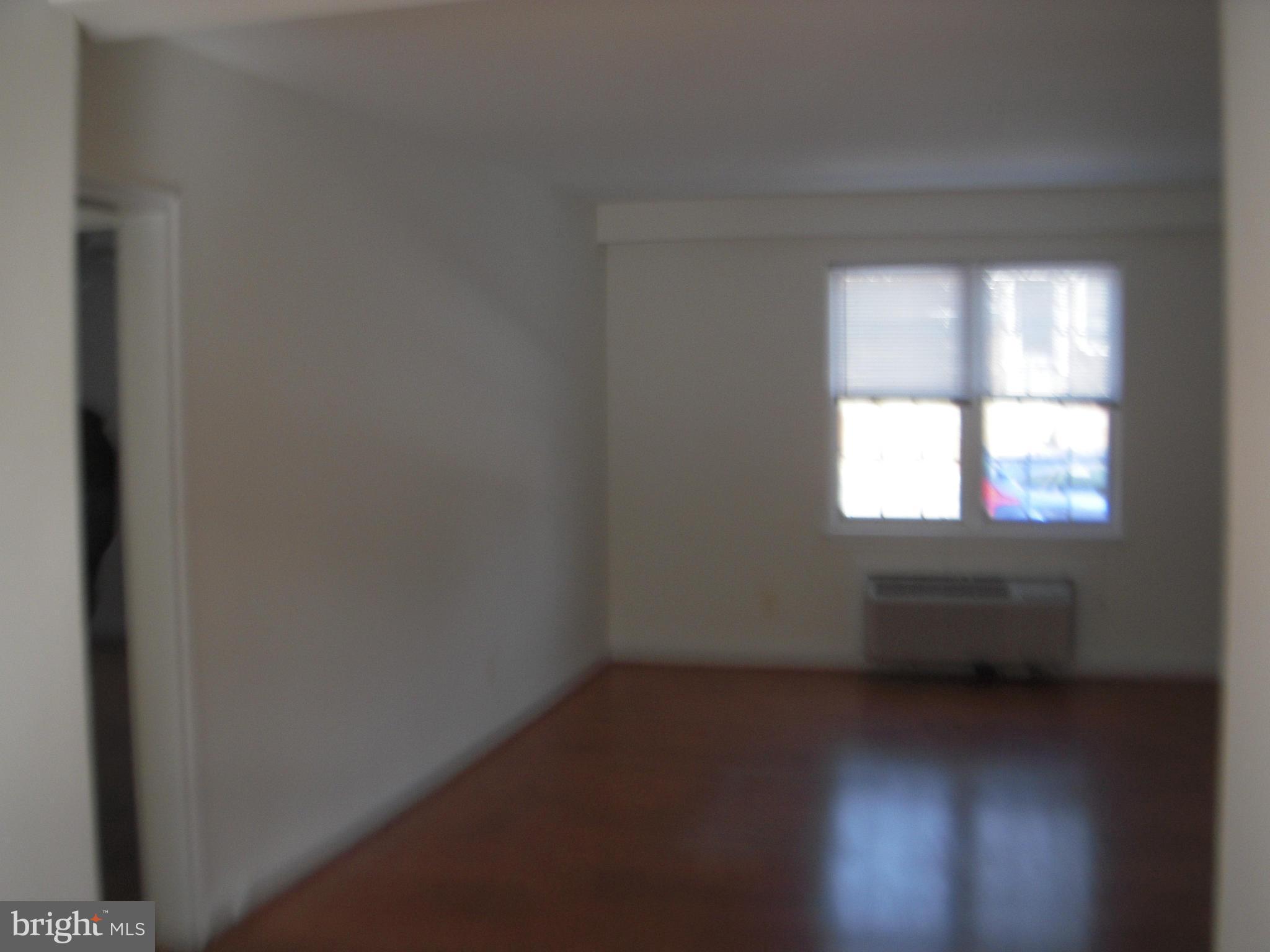 109 East Glebe Road, Unit D Alexandria, VA 22305 - Photo 22 of 28 an empty room with a window