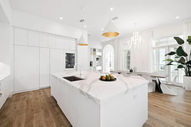 a view of a dining room with furniture and a window