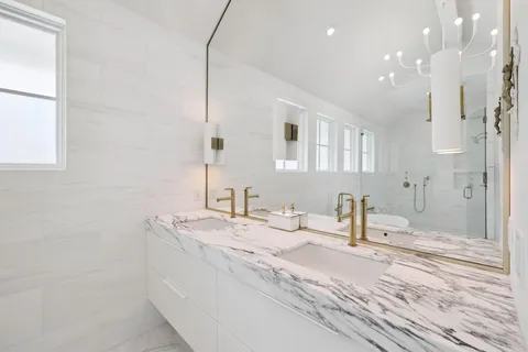 a bedroom with a bed and a desk