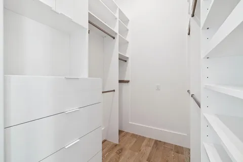 a bedroom with a bed and a ceiling fan