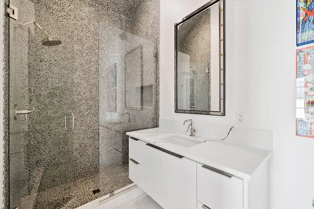 a view of spacious bedroom with furniture and a rug