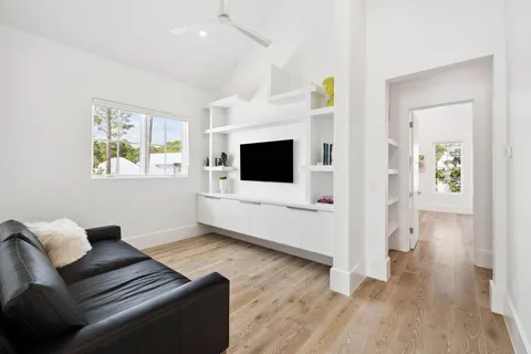 a view of entryway and hall with a mirror