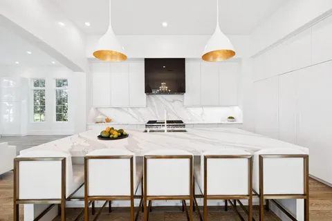 a dining room with furniture and wooden floor