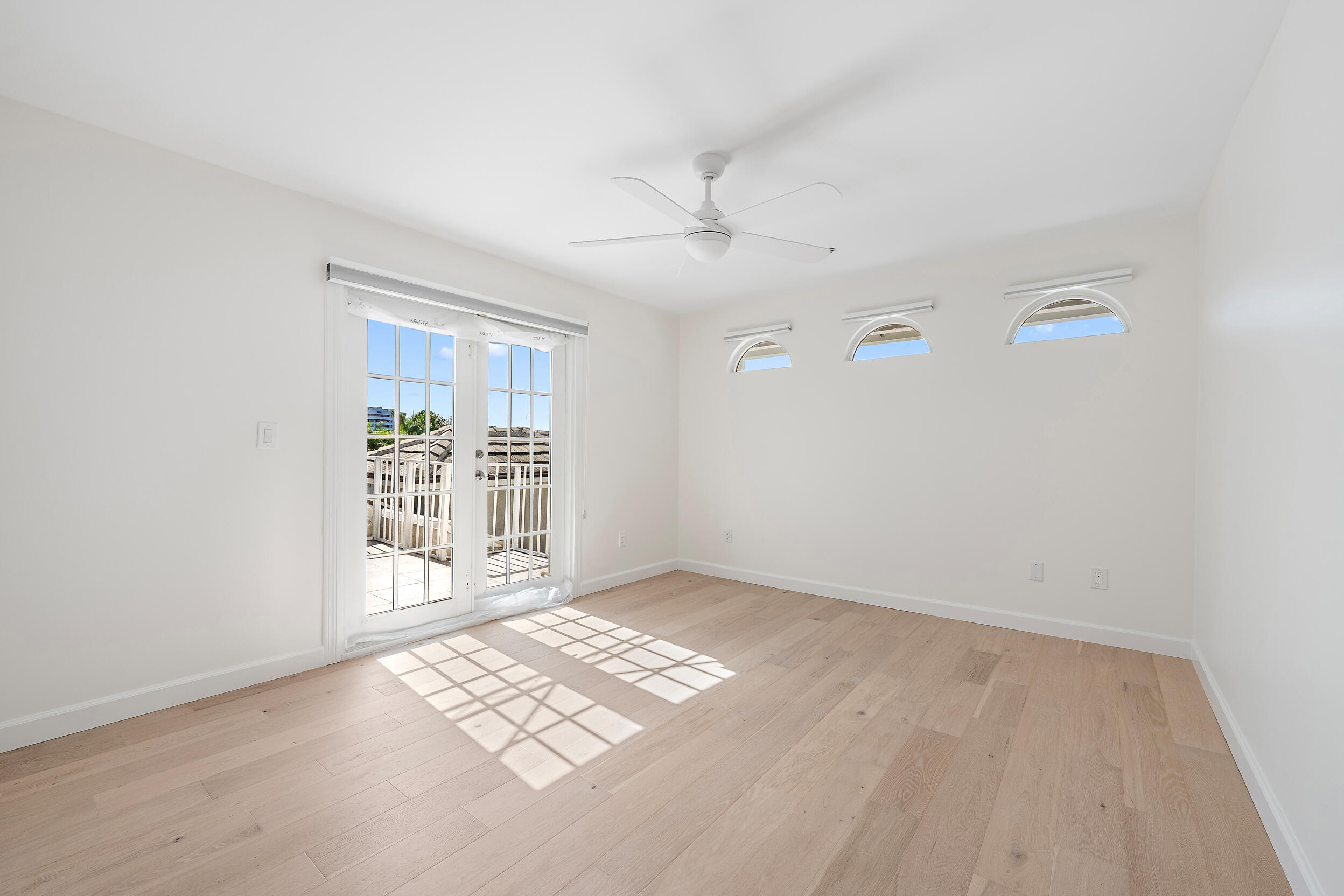 1000 North Us Highway, Unit 652 Jupiter, FL 33477 - Photo 23 of 64 an empty room with windows and fan