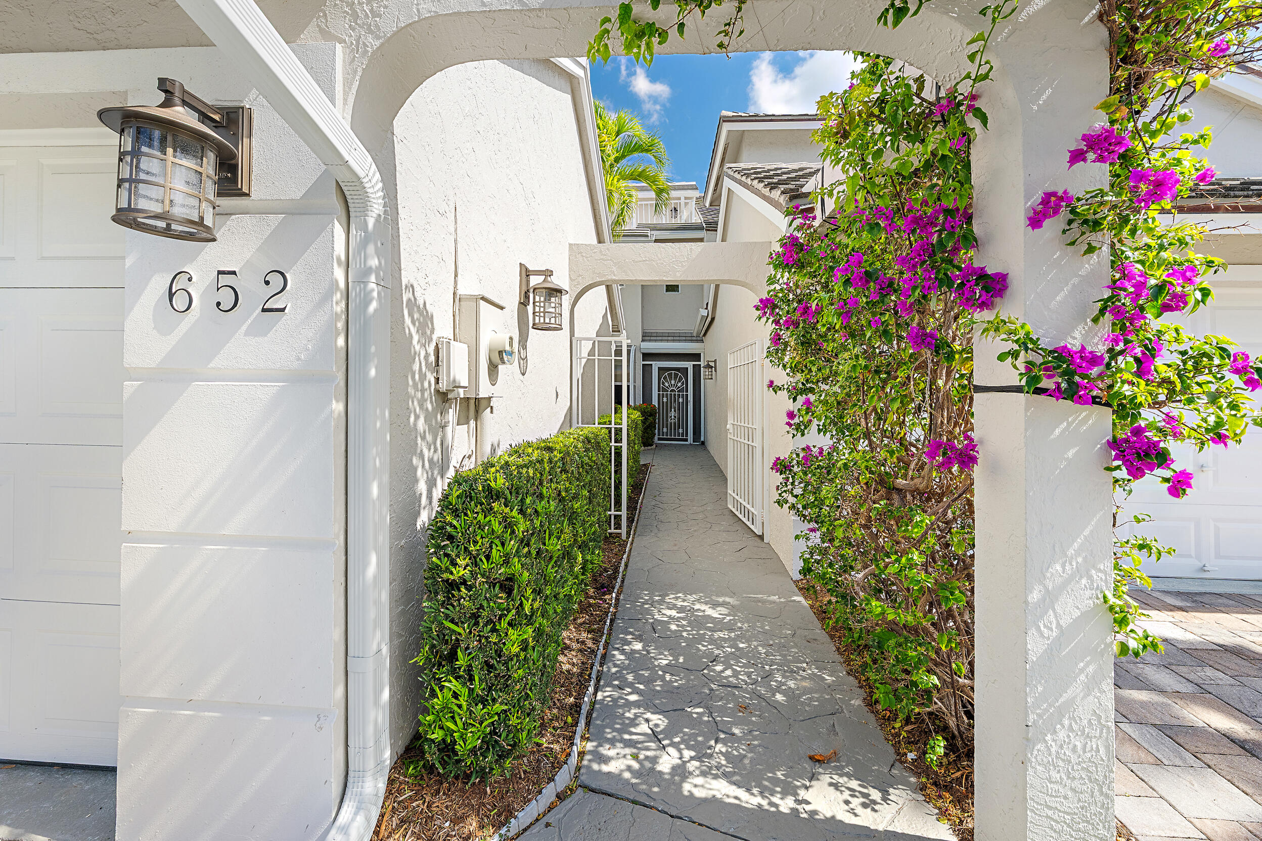 1000 North Us Highway, Unit 652 Jupiter, FL 33477 - Photo 5 of 64 a picture of flowers in front of a door