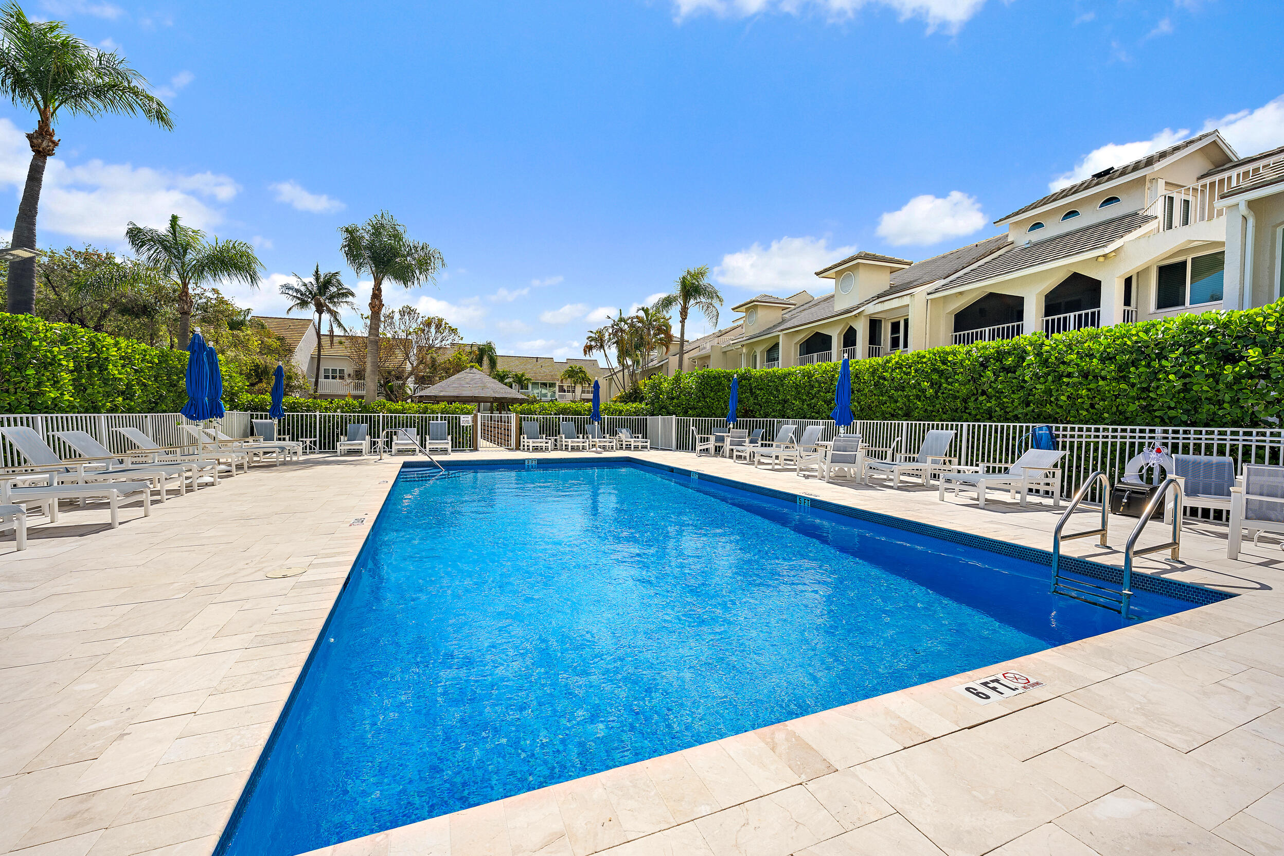1000 North Us Highway, Unit 652 Jupiter, FL 33477 - Photo 59 of 64 a swimming pool with outdoor seating and yard