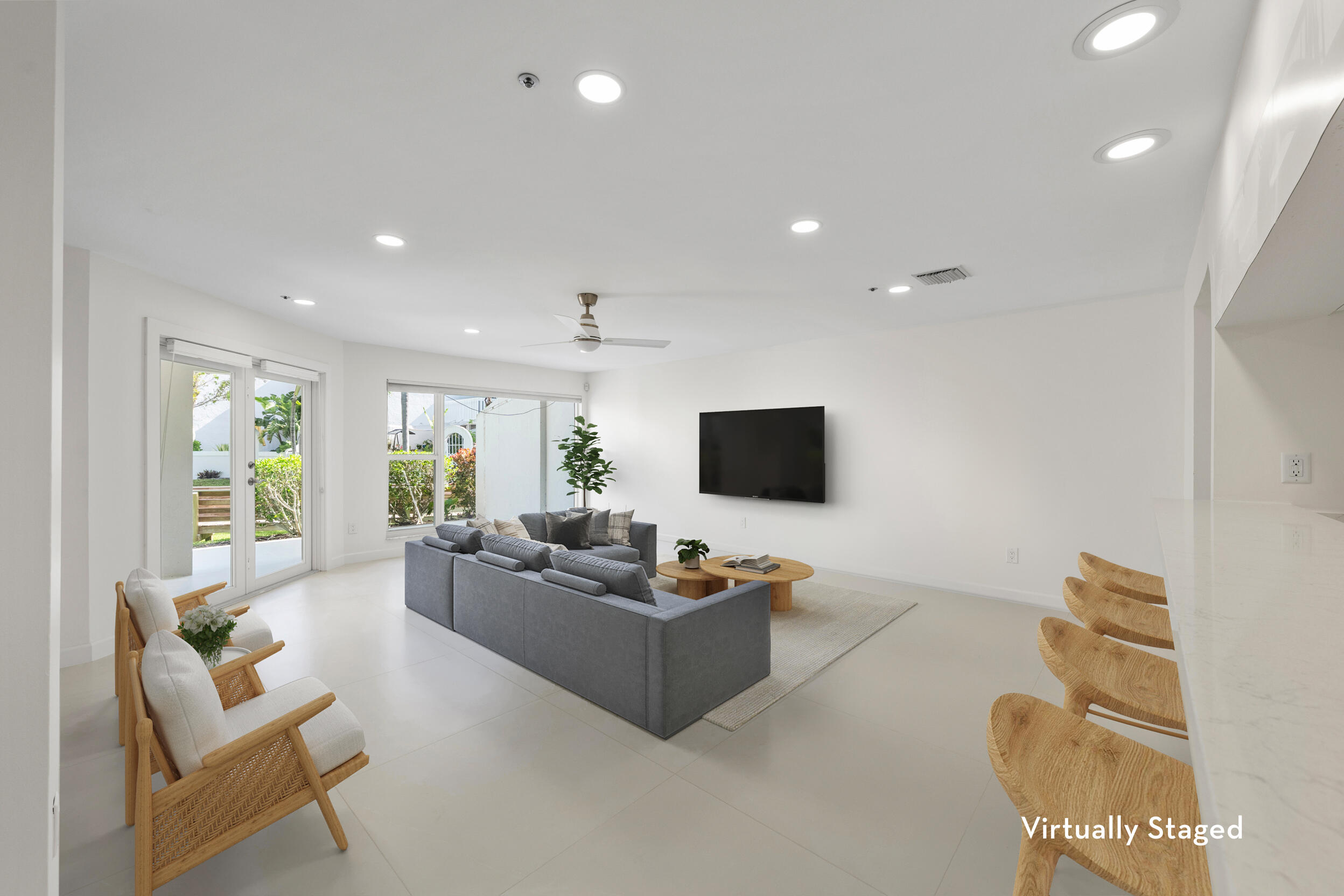 1000 North Us Highway, Unit 652 Jupiter, FL 33477 - Photo 8 of 64 a living room with furniture and a flat screen tv