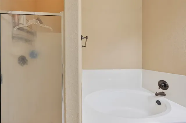 a bathroom with a white bath tub
