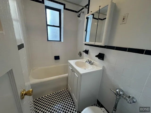 a bathroom with a sink and a shower