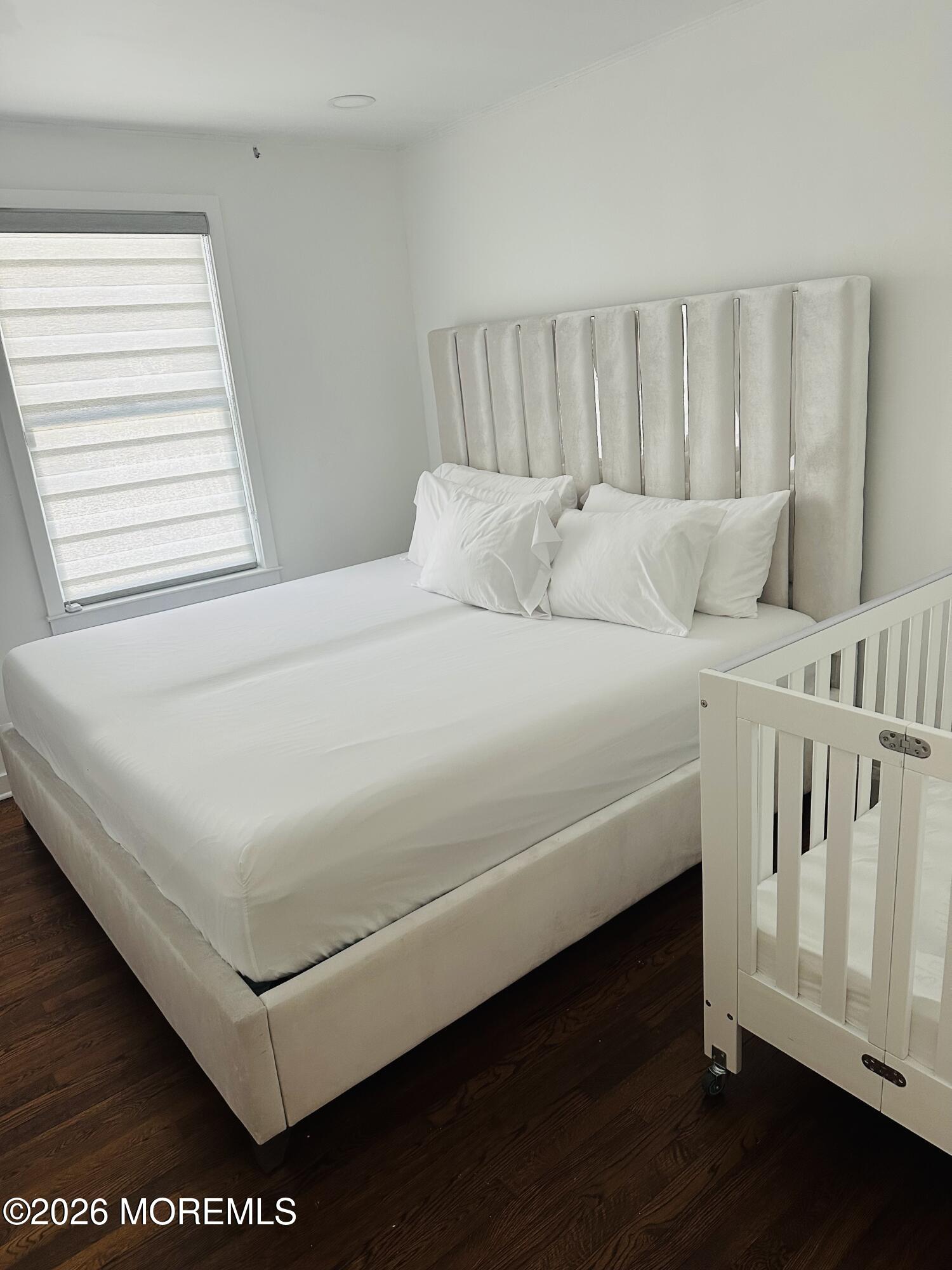 175 Delaware Avenue Oakhurst, NJ 07755 - Photo 11 of 24 a white bed sitting in a bedroom next to a window