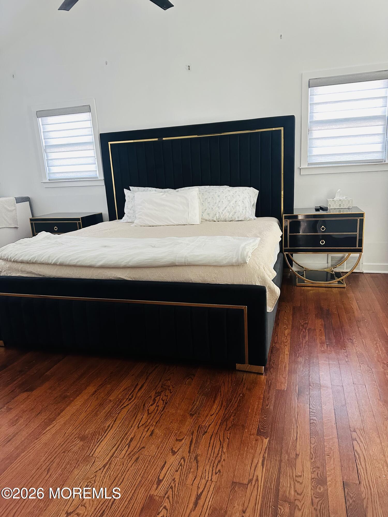 175 Delaware Avenue Oakhurst, NJ 07755 - Photo 13 of 24 a bedroom with a bed and wooden floor